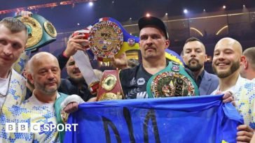 Oleksandr Usyk celebrating with his four belts after his victory over Tydon Fury
