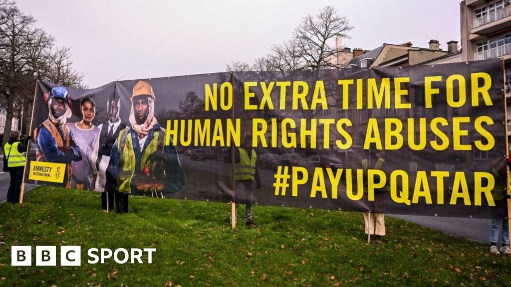 Amnesty International outside the Qatari embassy on International Migrants Day, in Brussels