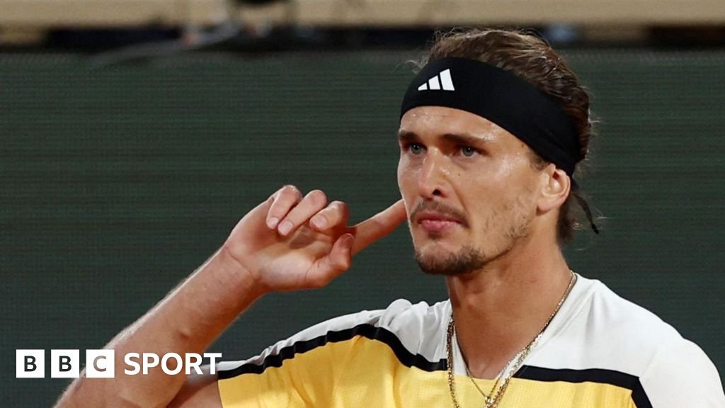 Alexander Zverev cups his ear at the French Open