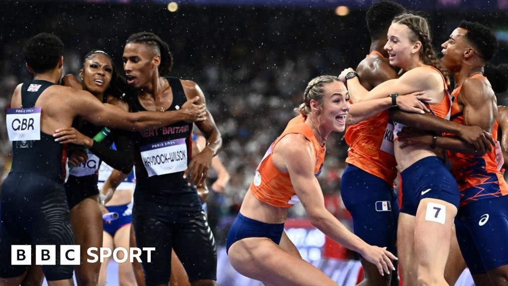 Great Britain and the Netherlands teams celebrate their respective mixed 4x400m relay medals